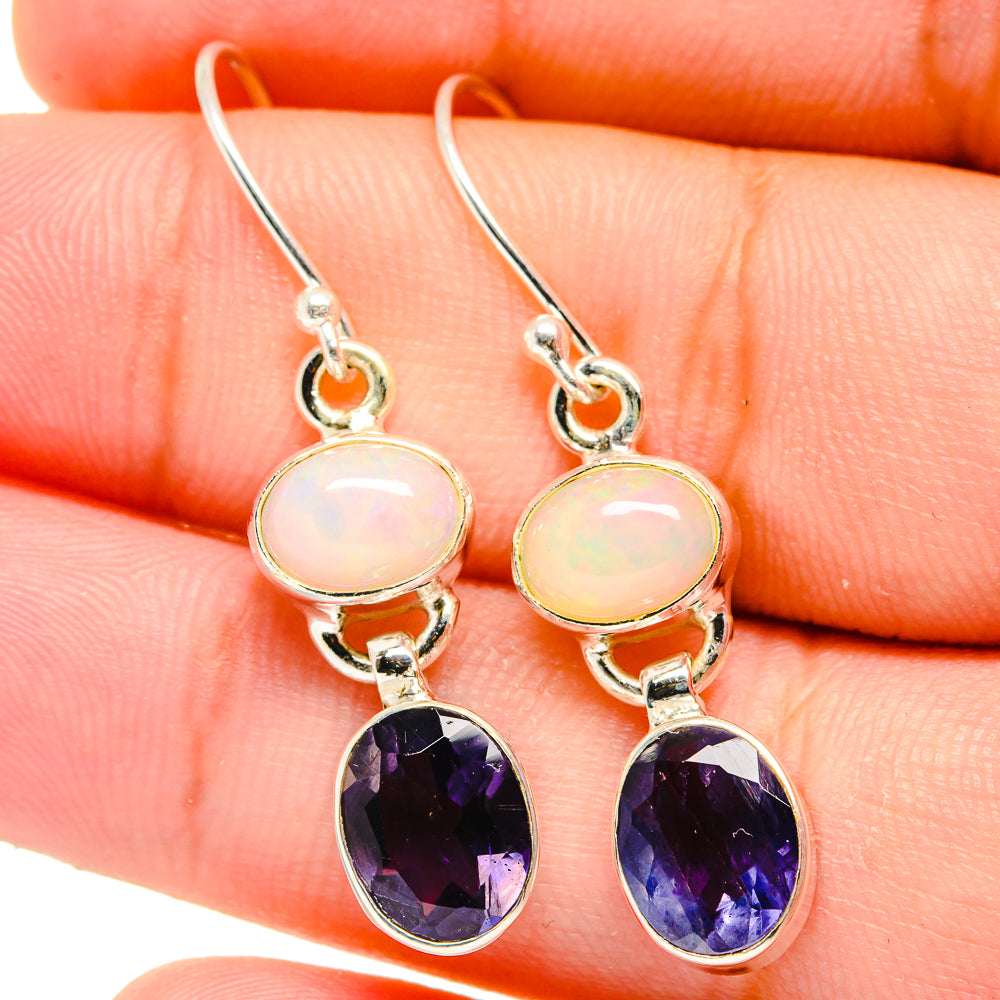 Sterling silver drop earrings with orange opal round tops and faceted deep purple teardrops