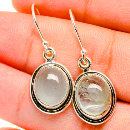 Sterling silver oval aquamarine drop earrings with blackened bezel and fishhook backs