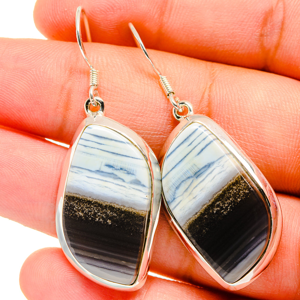 Teardrop opal earrings in sterling silver with blue, white, and gold stone insets