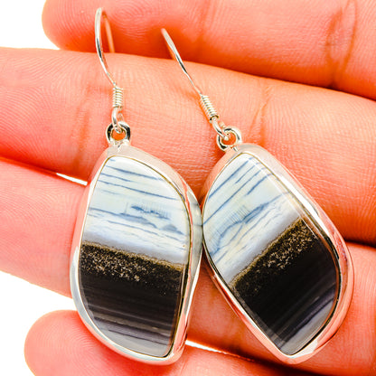 Teardrop opal earrings in sterling silver with blue, white, and gold stone insets
