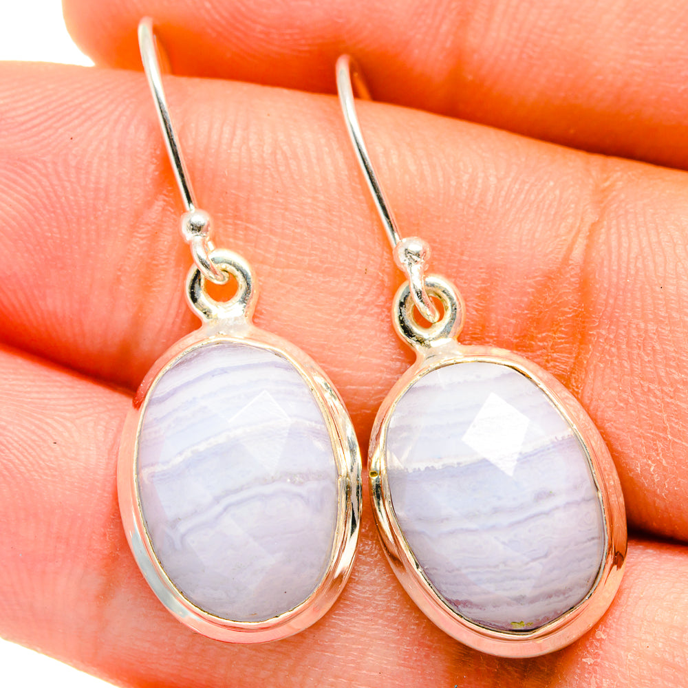 Sterling silver oval drop earrings with blue lace agate stones and loop hooks.