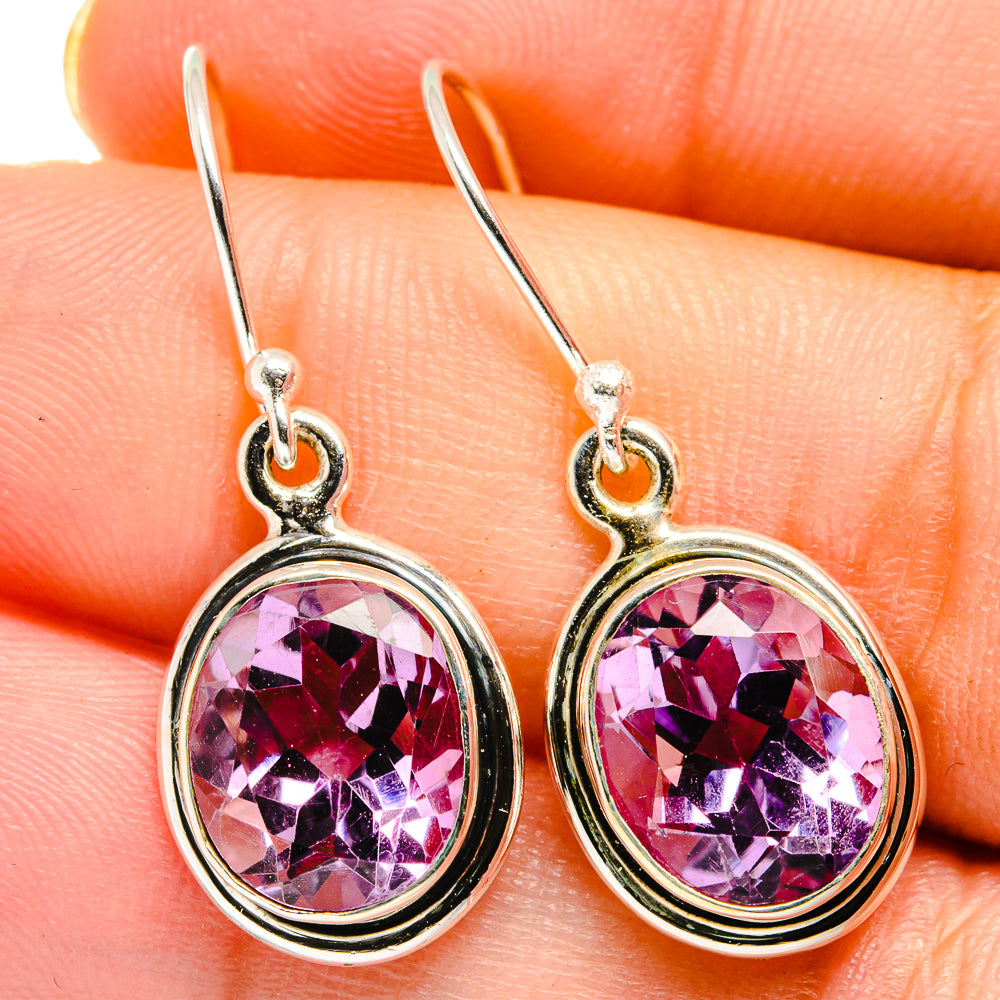 Sterling silver oval amethyst faceted earrings with small circular halo, close view