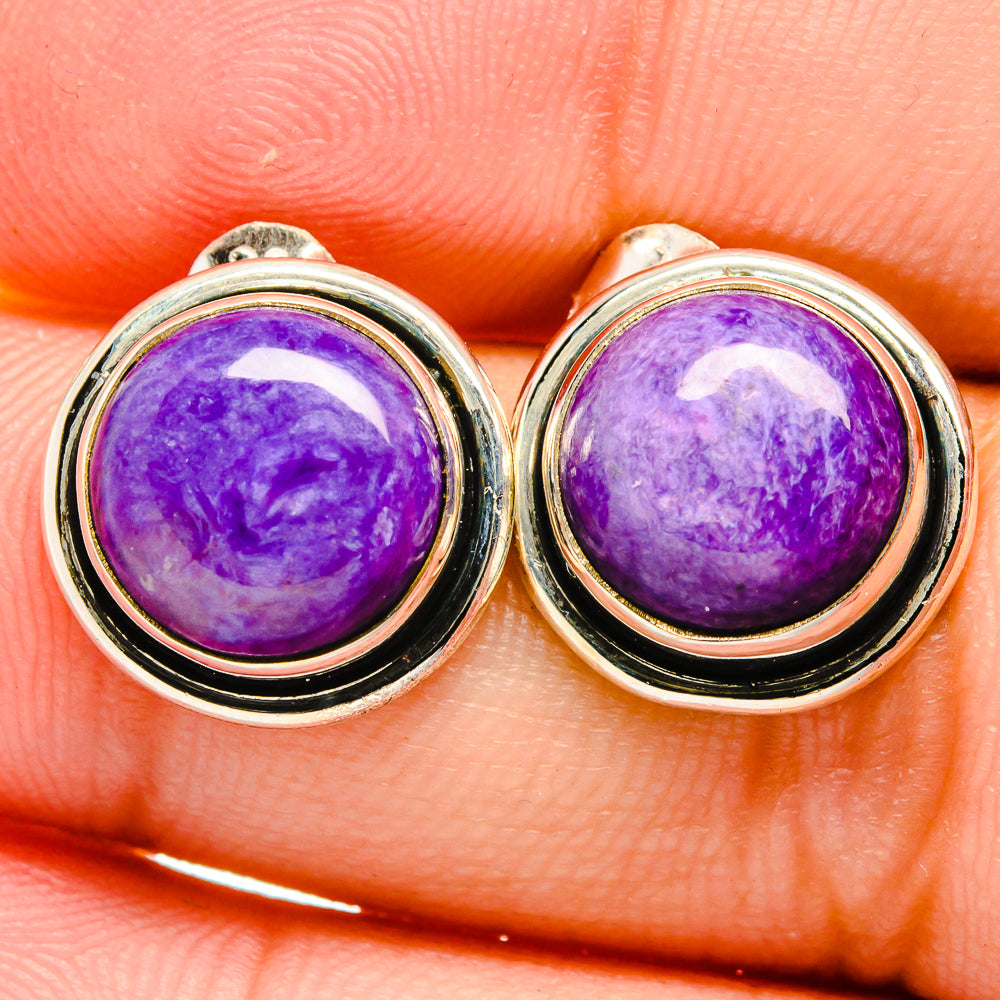Sterling silver stud earrings with domed purple charoite cabochons and black bezel