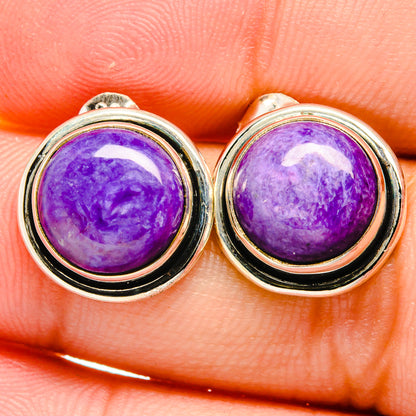 Sterling silver stud earrings with domed purple charoite cabochons and black bezel