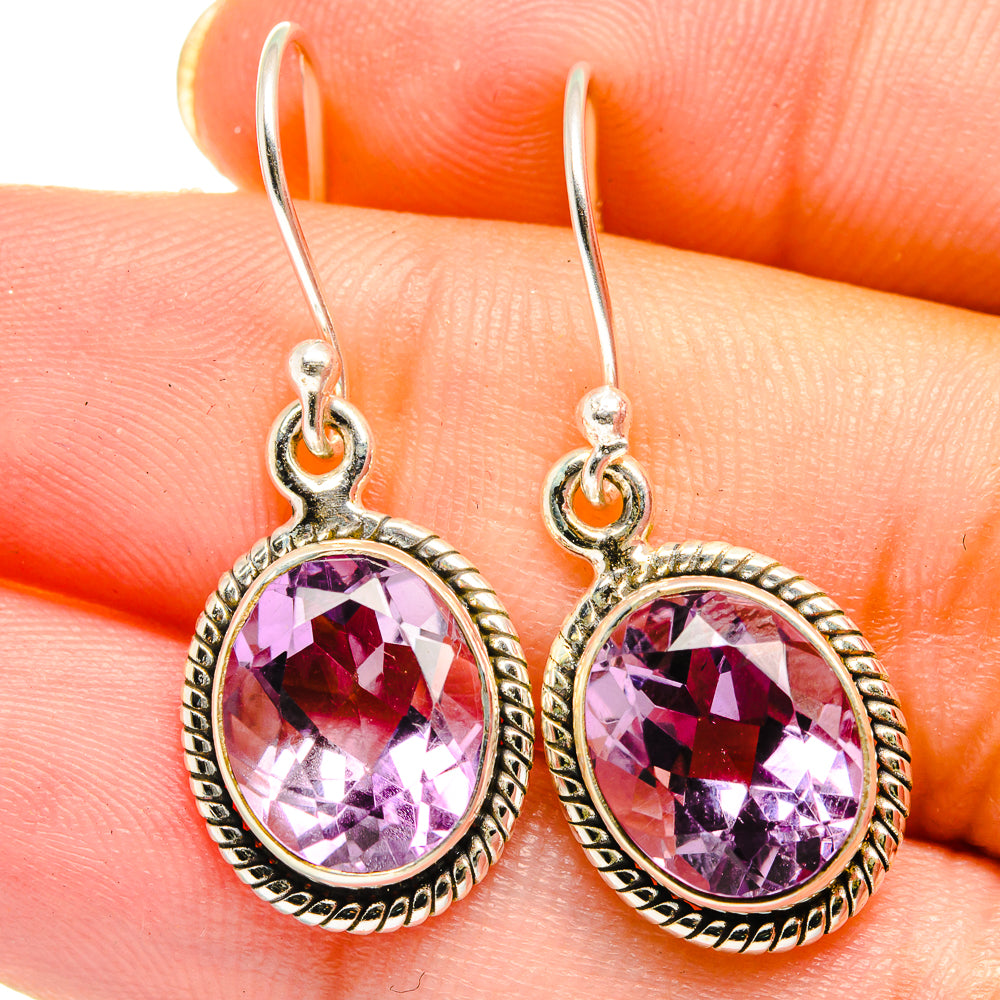 925 sterling silver amethyst drop earrings close-up, faceted oval purple stones and loop hooks