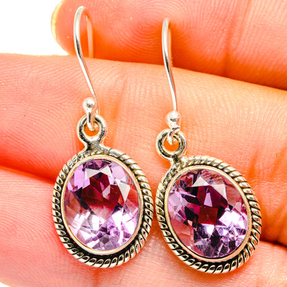 925 sterling silver amethyst drop earrings close-up, faceted oval purple stones and loop hooks