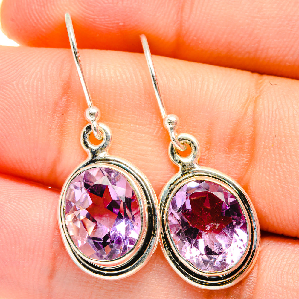 Sterling silver amethyst drop earrings with faceted purple gemstones and loop tops