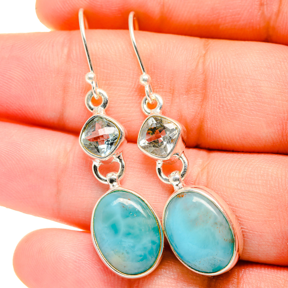 Silver-tone drop earrings with faceted clear stones and turquoise oval bottom dangles