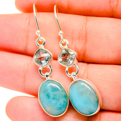 Silver-tone drop earrings with faceted clear stones and turquoise oval bottom dangles