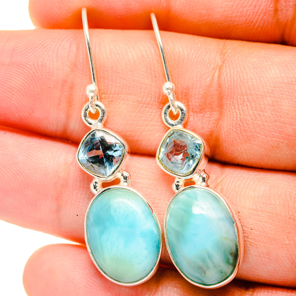 Sterling silver drop earrings with blue topaz-like stones and oval turquoise cabochons