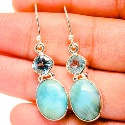 Sterling silver drop earrings with blue topaz-like stones and oval turquoise cabochons