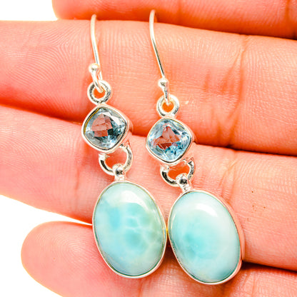 Sterling silver drop earrings with blue topaz top and oval larimar drops