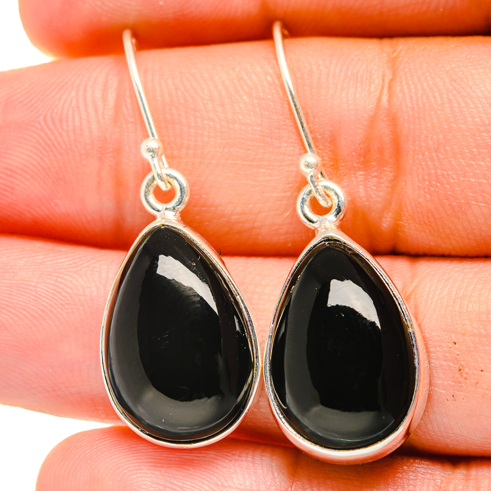 Black onyx teardrop drop earrings on sterling silver hooks, glossy stone