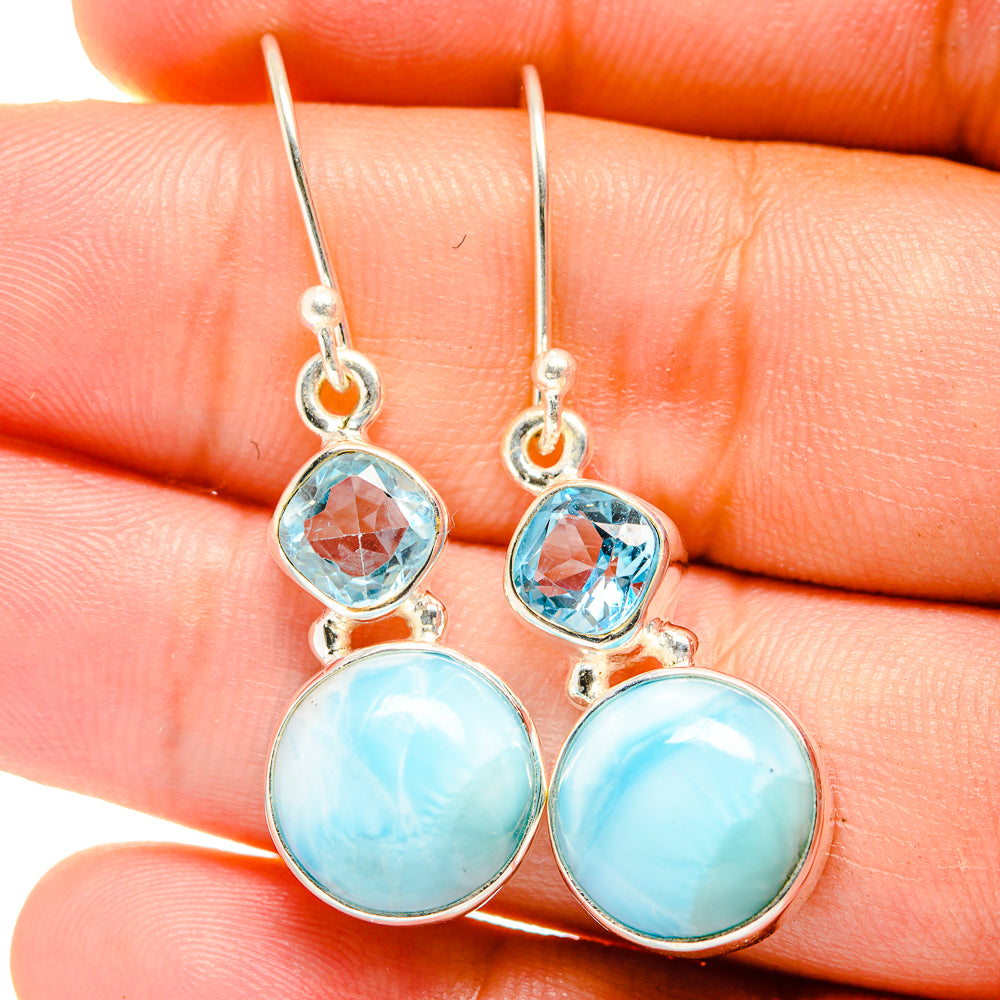 Sterling silver drop earrings with faceted blue topaz and round larimar stones