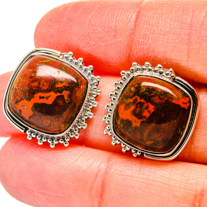 Sterling silver agate stud earrings with textured halo bezel, orange-brown cabochon