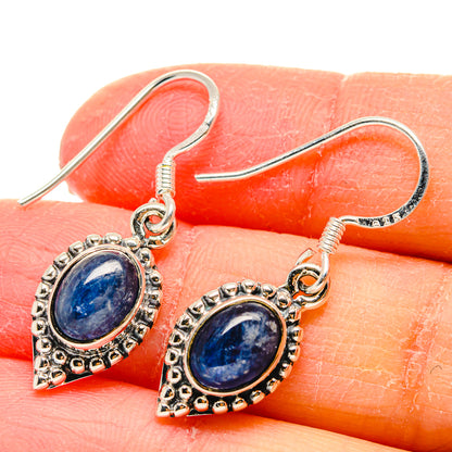 925 sterling silver kyanite drop earring close-up with blue oval cabochon and ornate bezel