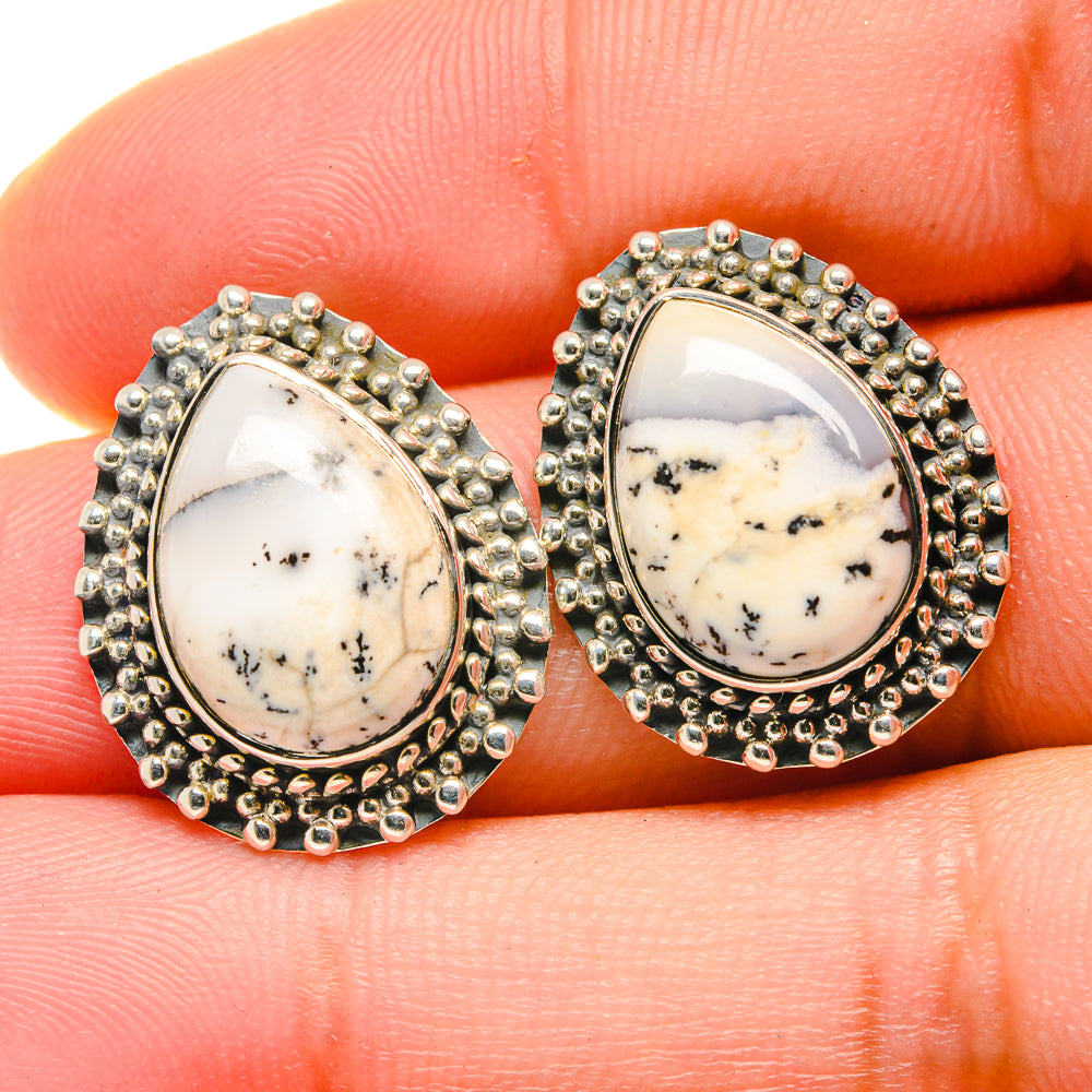 Dendritic opal stud earrings close-up, oval teardrop opal in silver bead trim