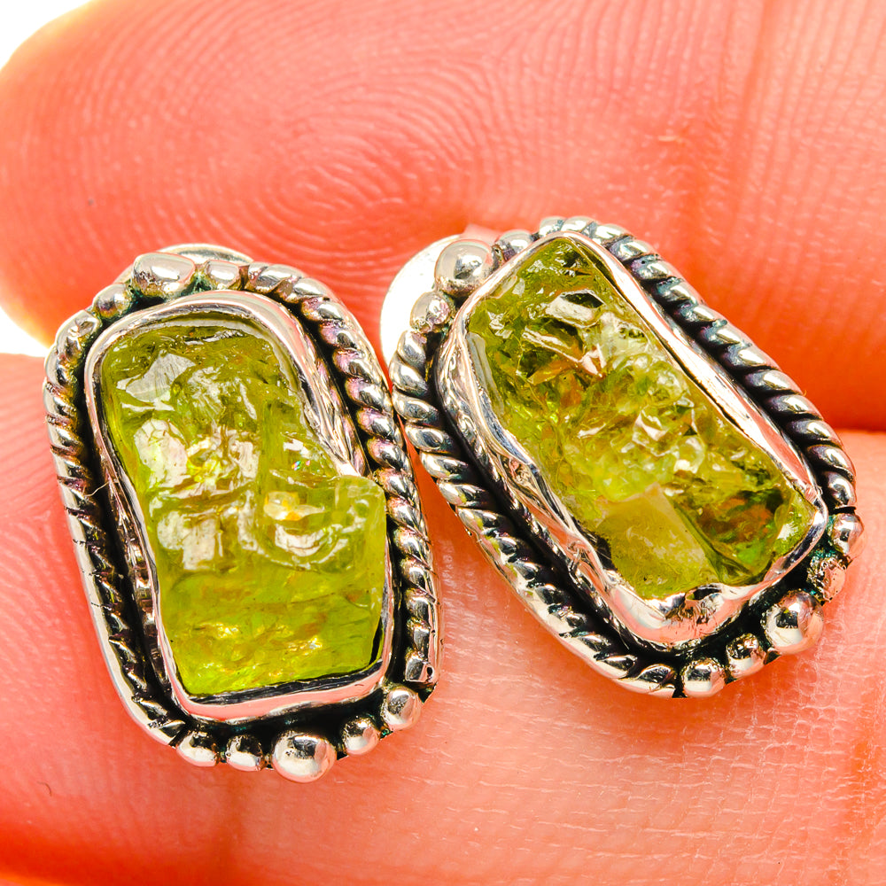 Rough peridot earrings in 925 sterling silver with green textured stones, rope-style bezel