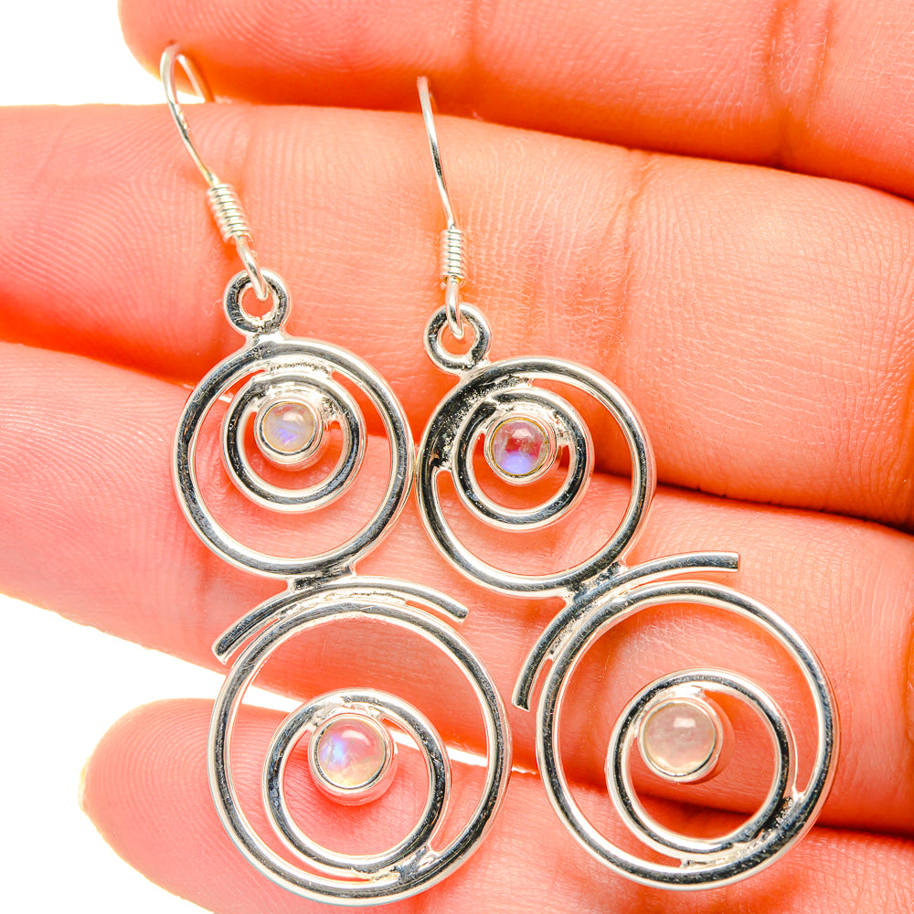 Round 925 silver dangle earrings with moonstone cabochons in spiral circular frames