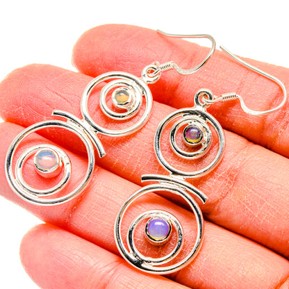 Sterling silver opal-like drop earrings with three stacked spiral circles