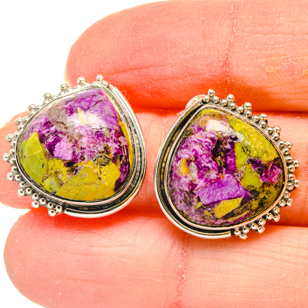 Atlantisite teardrop earrings close-up, sterling silver setting with vivid purple and yellow