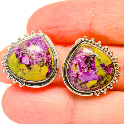 Atlantisite teardrop earrings close-up, sterling silver setting with vivid purple and yellow
