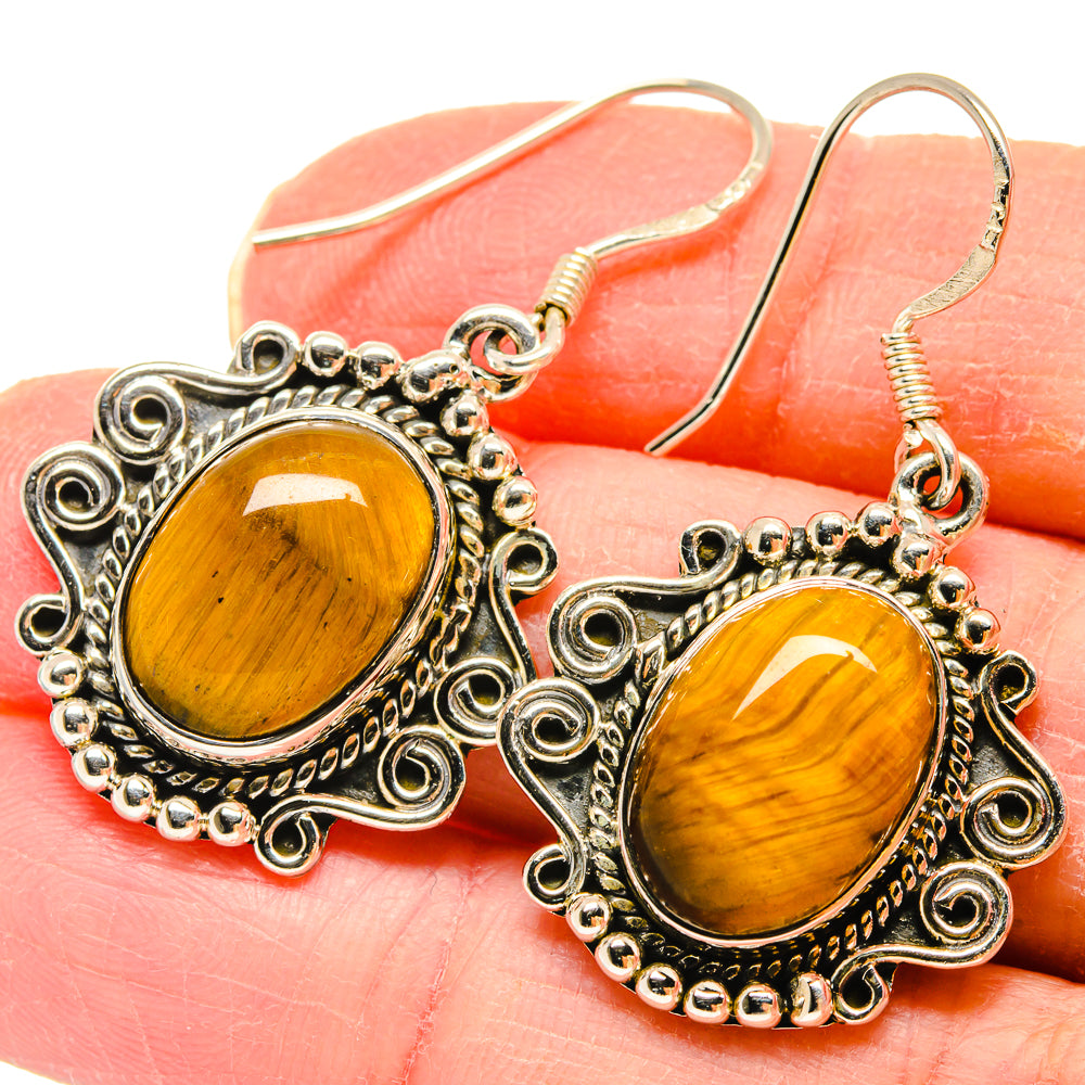 Sterling silver tiger eye oval drop earrings with ornate filigree frames