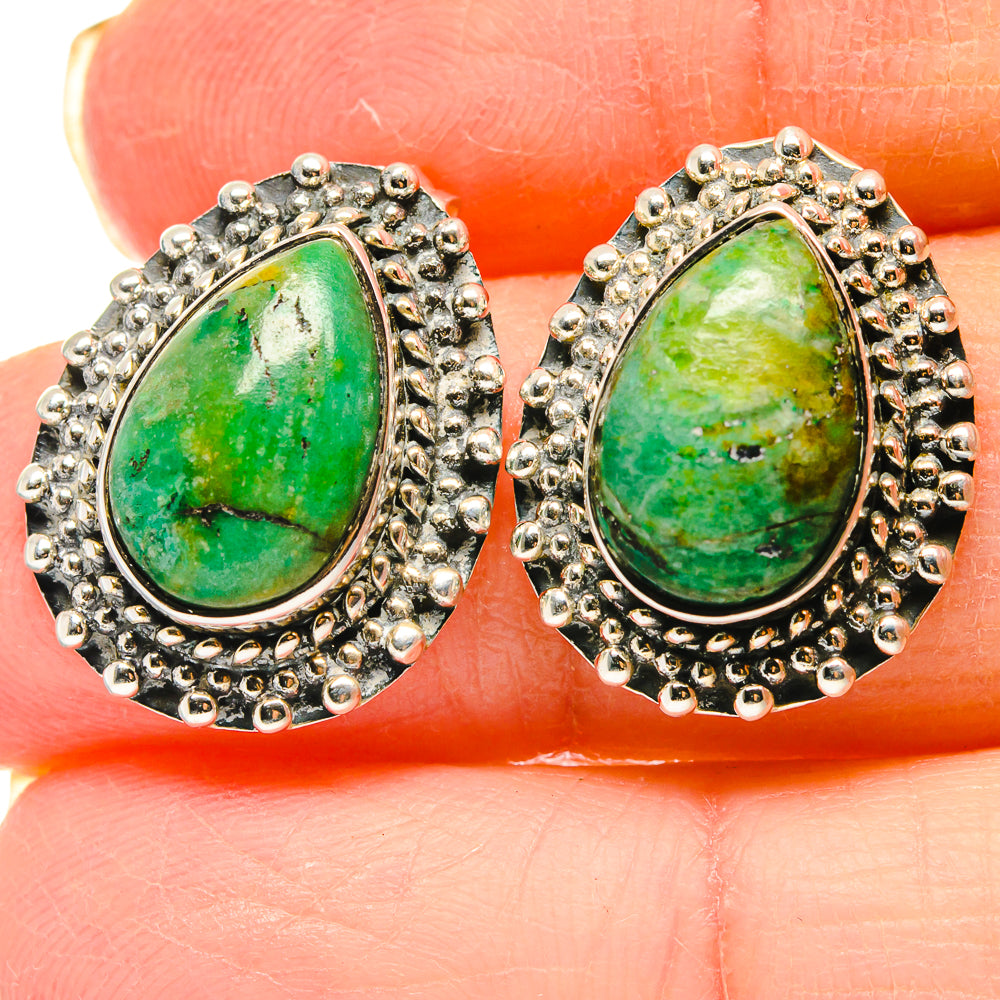 Sterling silver teardrop earrings with green gemstone cabochon and ornate bead border