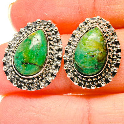 Sterling silver teardrop earrings with green gemstone cabochon and ornate bead border