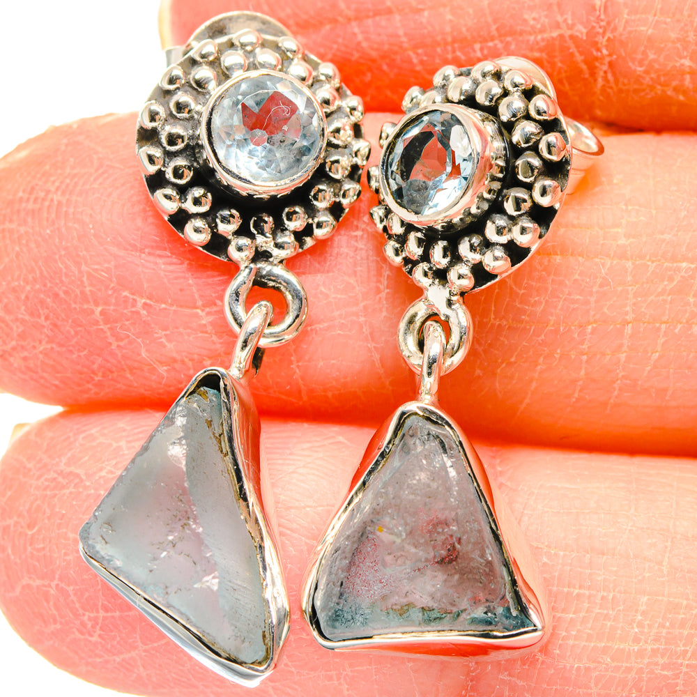 Sterling silver blue topaz drop earrings with round halo and triangular dangle