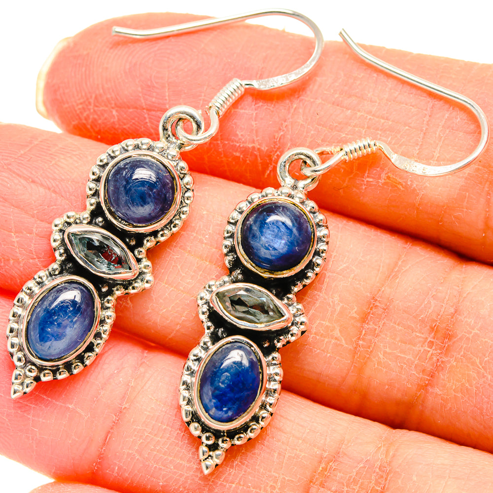 Sterling silver kyanite drop earrings with blue oval stones and ornate settings