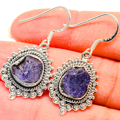 Sterling silver rough tanzanite earrings with purple oval stones and filigree border