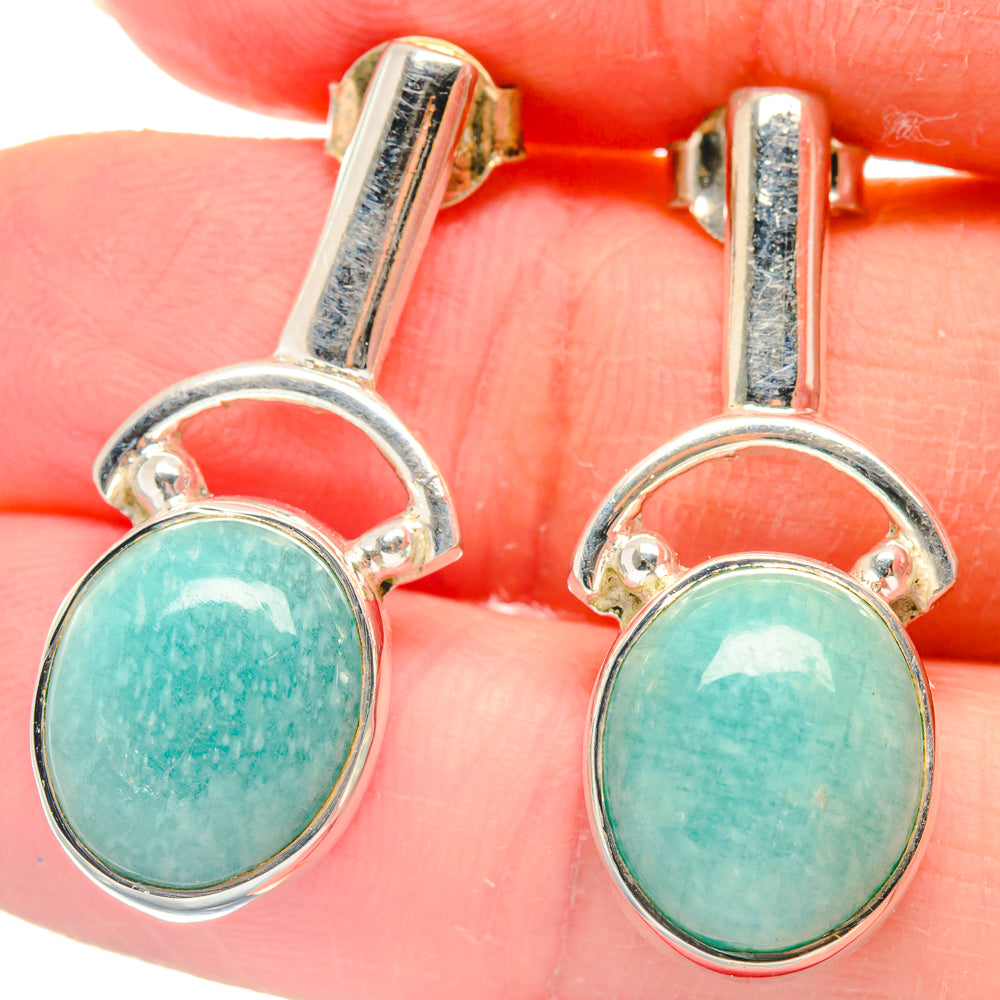 Amazonite earrings close-up: round turquoise-green stones in 925 sterling silver bezel