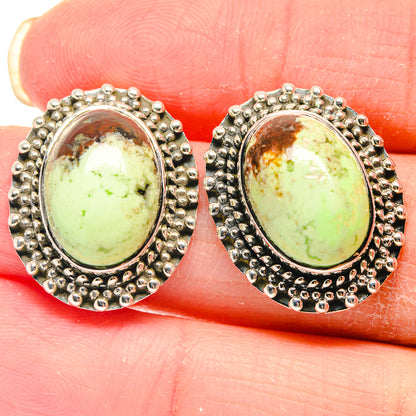 Sterling silver oval chrysoprase earrings with beaded halo and lever backs, close-up