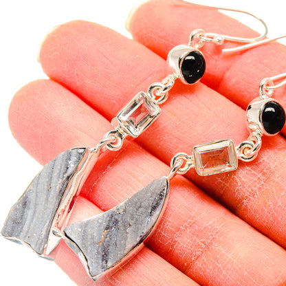 Dangle earrings with silver hooks, black onyx rounds, and druzy quartz geometric drops