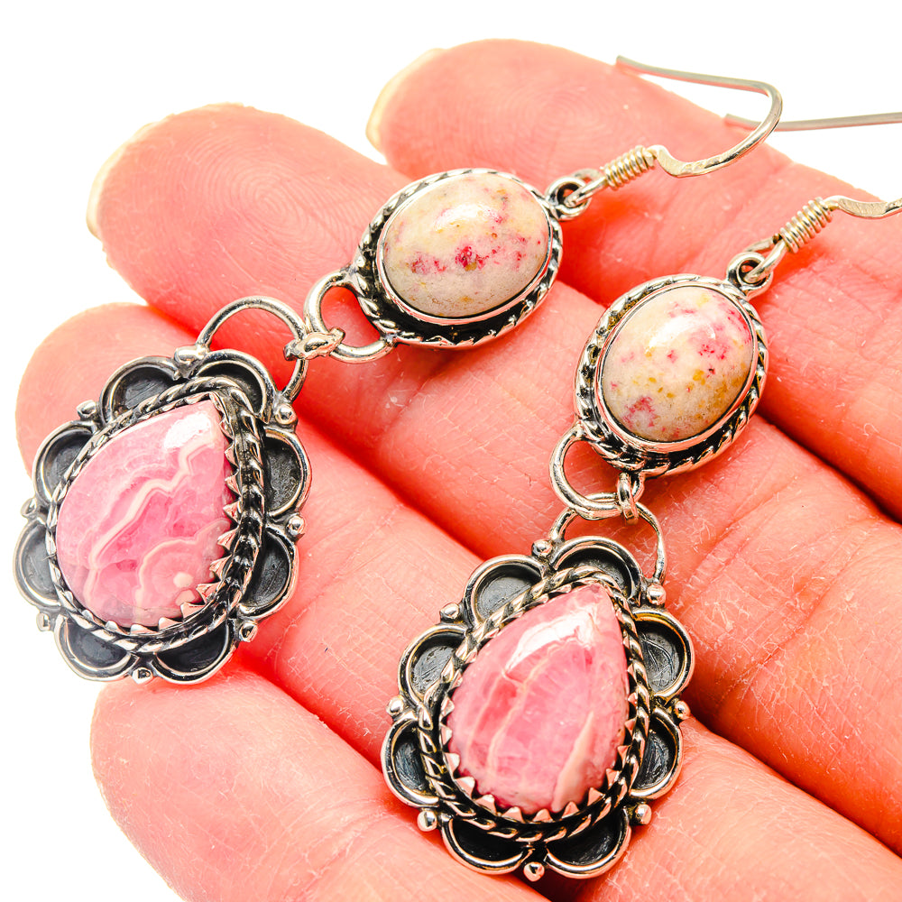 Sterling silver dangle earrings with pink speckled oval stones and pink teardrop cabochons.