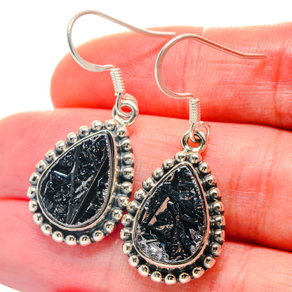Sterling silver teardrop earrings with rough black galena stones and beaded border