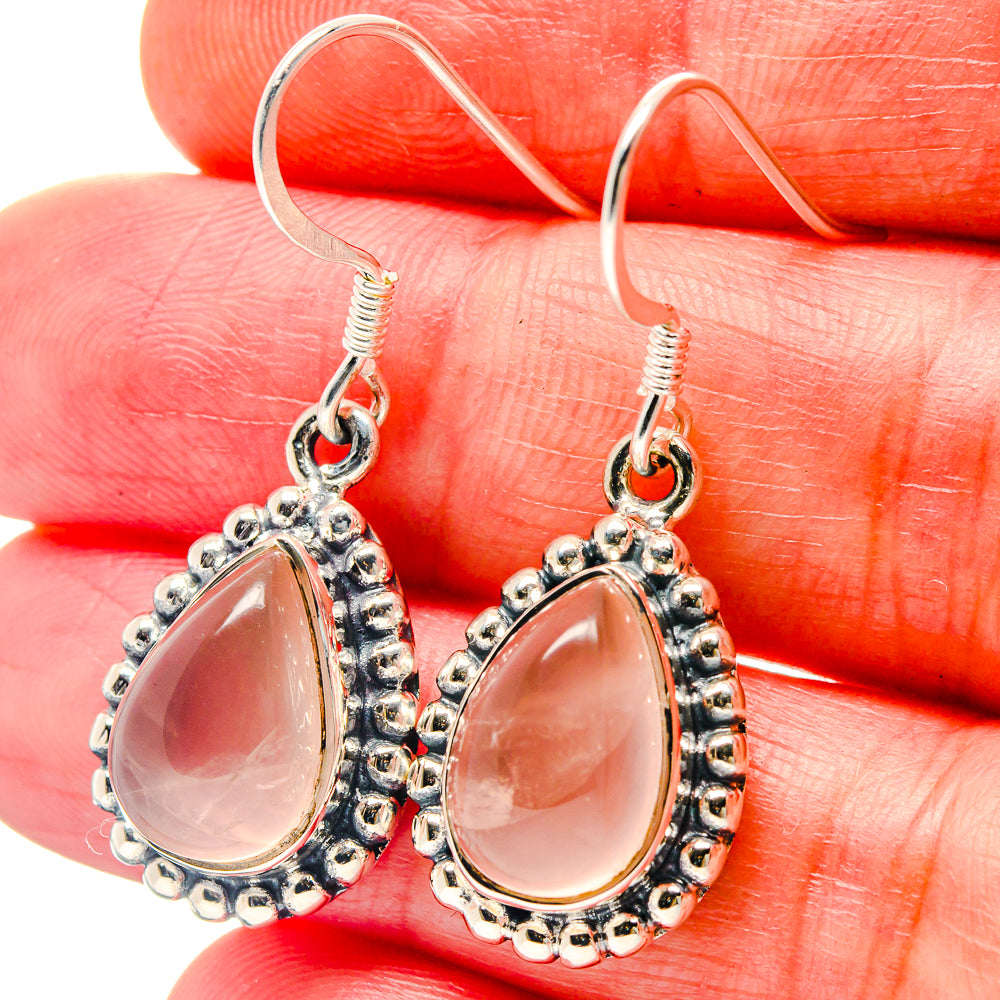 Rose quartz teardrop earrings in silver-tone with scalloped bezel and hook backs
