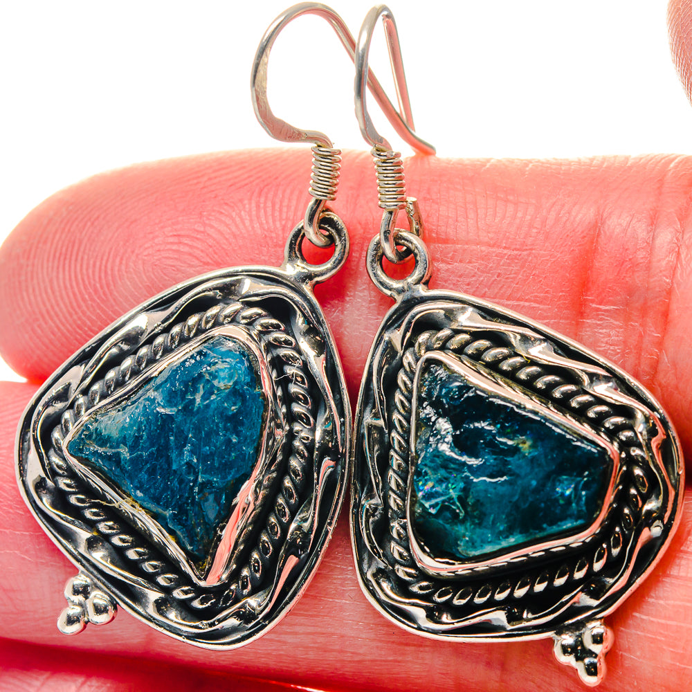 Sterling silver apatite earrings with rough blue teardrop stones and ornate oval frames