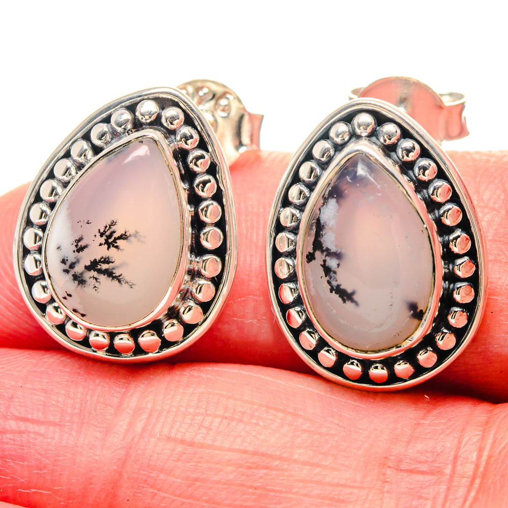 Sterling silver teardrop opal earrings with black dendritic tree pattern and beaded bezel