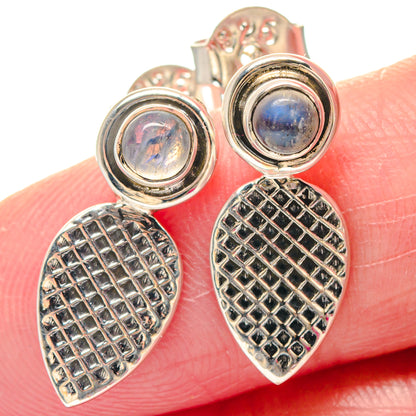 Sterling silver earrings with blue rainbow moonstone cabochons and textured teardrop drops