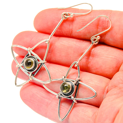 Sterling silver labradorite drop earrings showing round stone in star bezel
