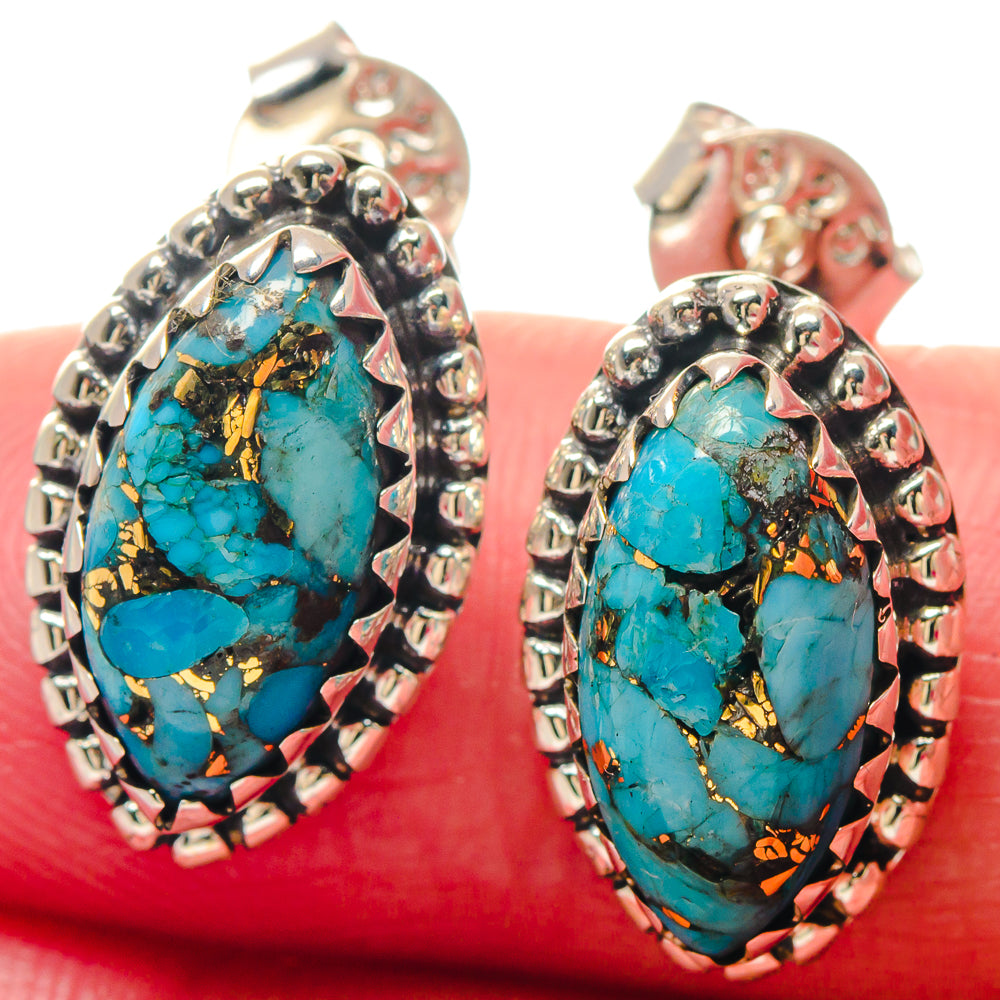 Turquoise oval earrings with blue stone and gold veining in silver-tone bezel setting