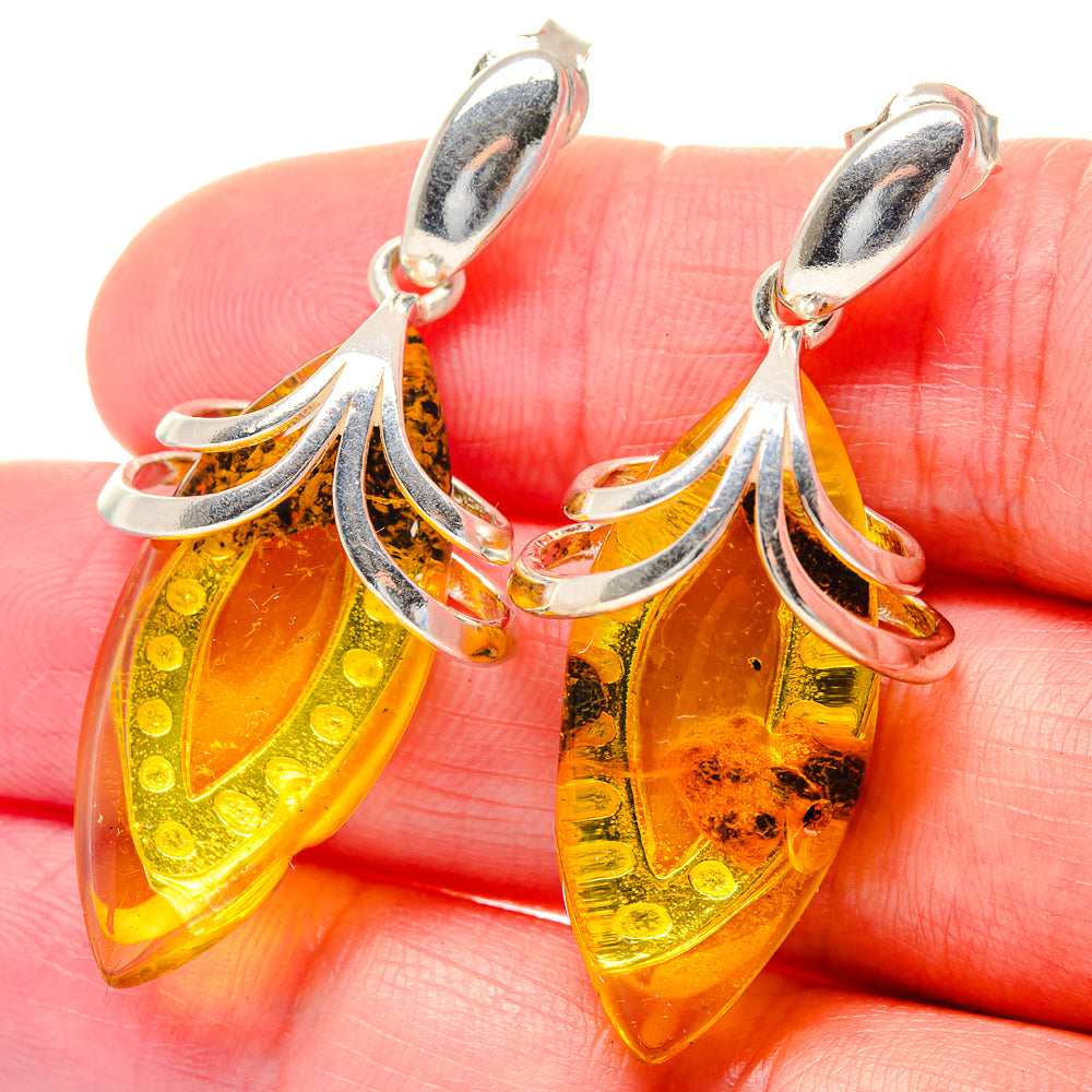 Citrine teardrop drop earrings in 925 sterling silver with faceted amber yellow stone