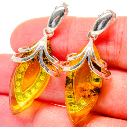 Citrine teardrop drop earrings in 925 sterling silver with faceted amber yellow stone