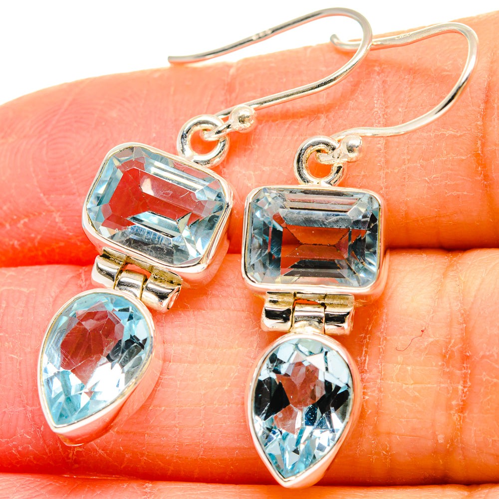 925 sterling silver blue topaz earrings close-up: rectangular top stone and teardrop charm