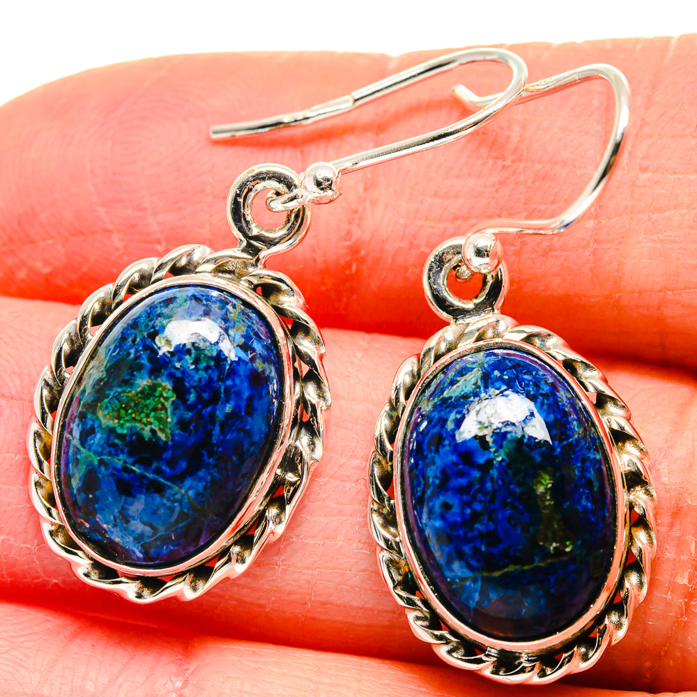 Oval blue azurite cabochon earrings with scalloped gold-tone settings and fishhook backs