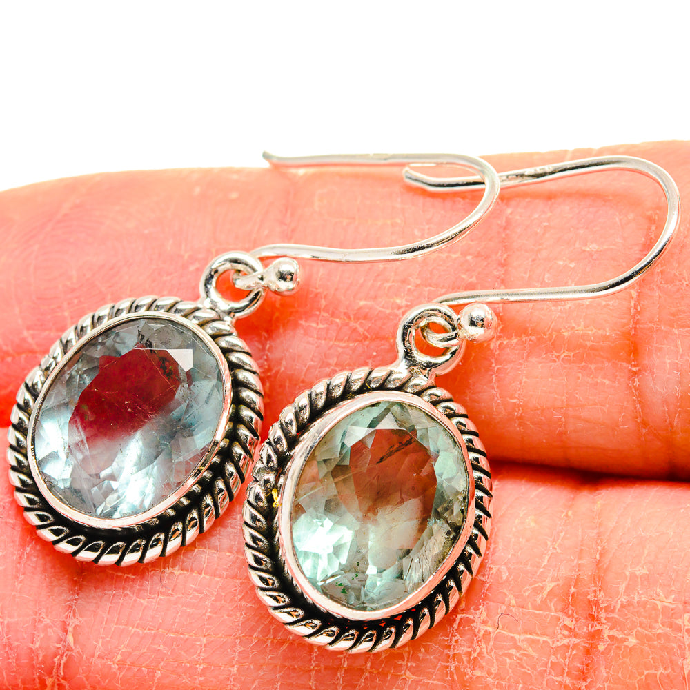 Oval teal green faceted earrings with silver beaded bezel and french hooks