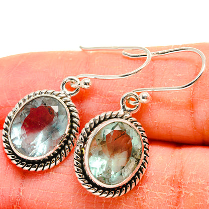 Oval teal green faceted earrings with silver beaded bezel and french hooks