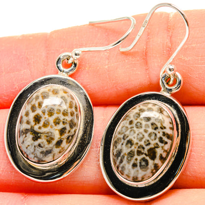Oval sterling silver drop earrings with coral-like patterned stone and round bezel